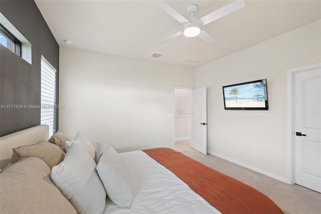 bedroom featuring ceiling fan and light carpet