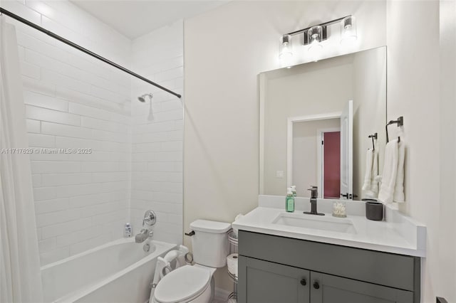 full bathroom featuring shower / tub combo with curtain, vanity, and toilet