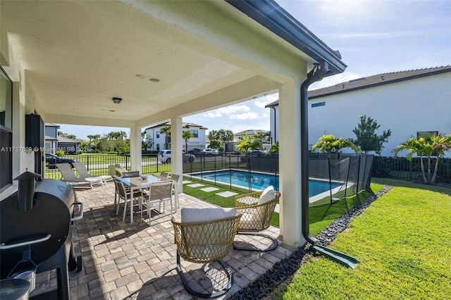 view of patio / terrace with a fenced in pool