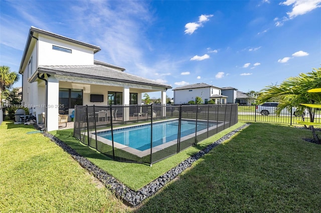 view of pool with a yard and a patio