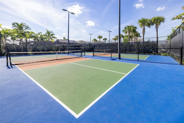 view of sport court with basketball hoop