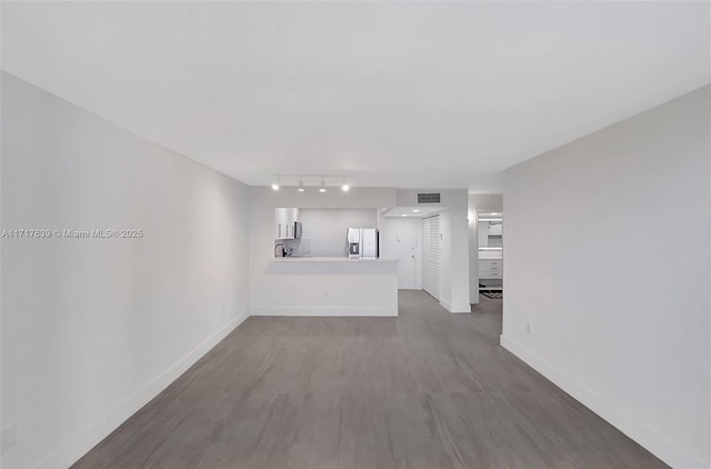 unfurnished living room with dark hardwood / wood-style floors