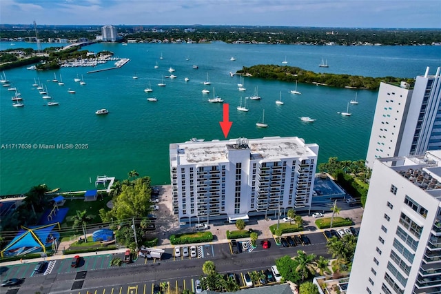 birds eye view of property featuring a water view