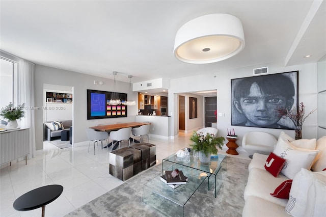 living room featuring light tile patterned flooring