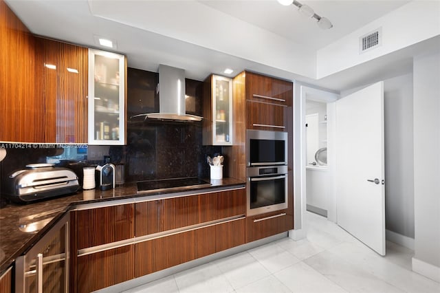 kitchen featuring wall chimney exhaust hood, tasteful backsplash, light tile patterned flooring, stainless steel appliances, and beverage cooler