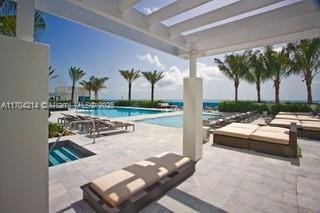 view of swimming pool featuring a patio