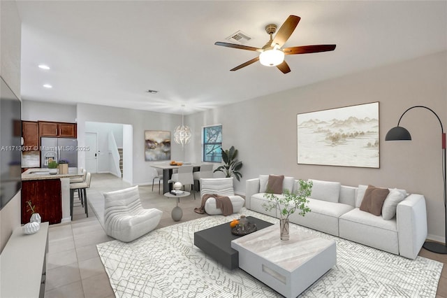 living room with ceiling fan and light tile patterned floors