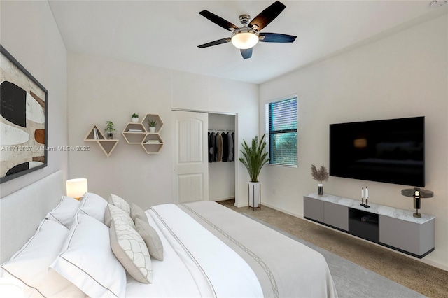 carpeted bedroom with ceiling fan and a closet