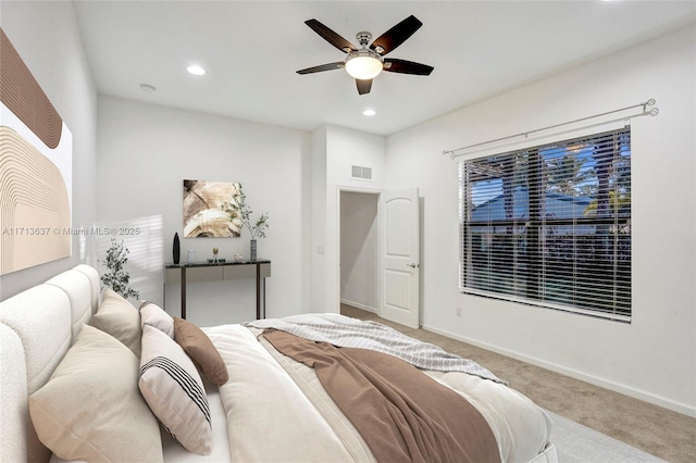 bedroom with ceiling fan and carpet floors