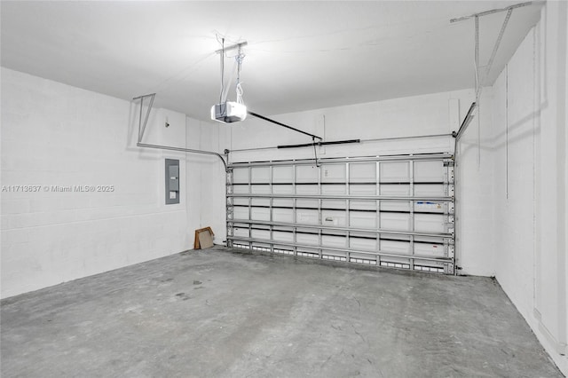 garage featuring electric panel and a garage door opener