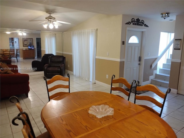 dining area with ceiling fan and light tile patterned flooring