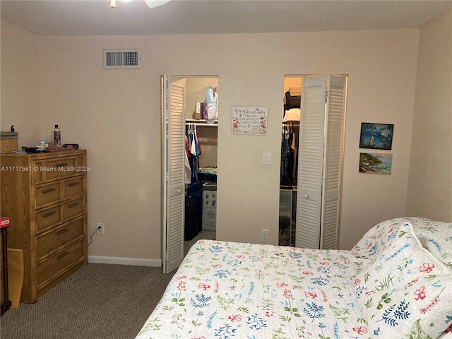 carpeted bedroom featuring a closet and a walk in closet