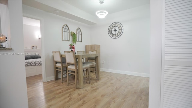 dining space with light wood-type flooring