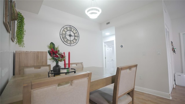 dining area featuring light wood-type flooring