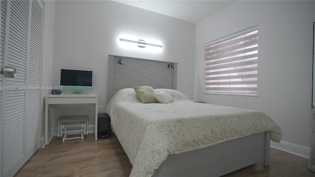 bedroom featuring dark hardwood / wood-style flooring