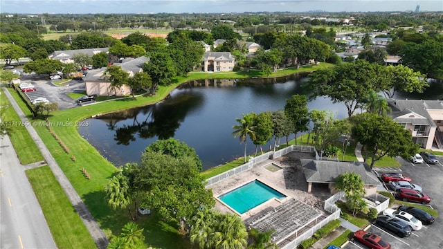 birds eye view of property with a water view