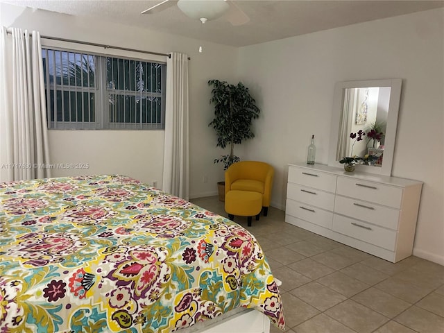 bedroom featuring ceiling fan and light tile patterned flooring