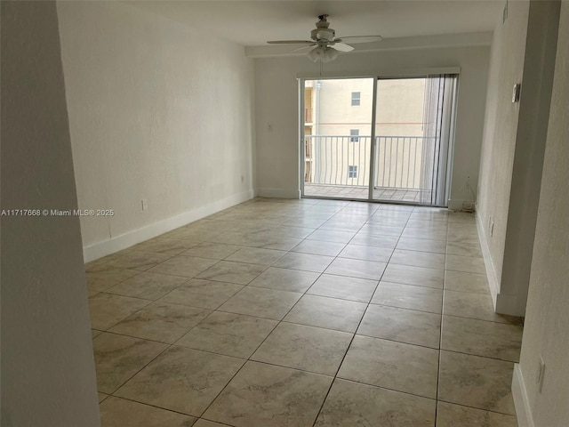 empty room with light tile patterned floors and ceiling fan