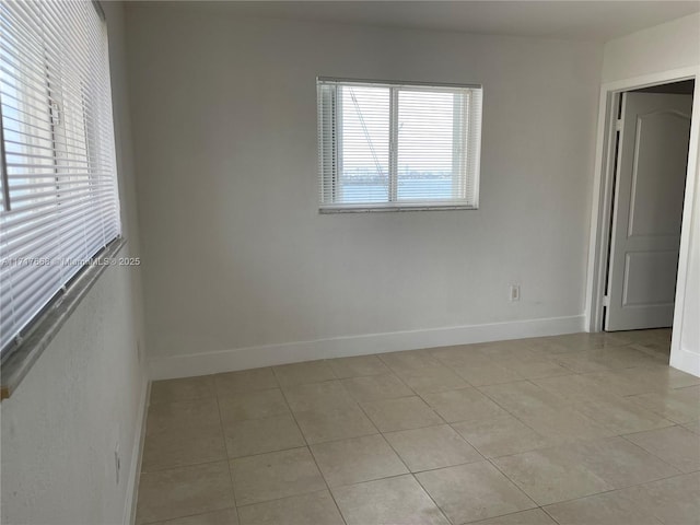 unfurnished room with light tile patterned floors