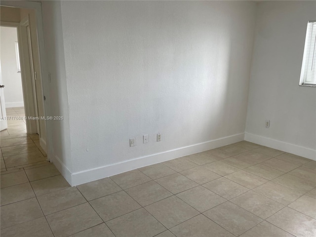 view of tiled spare room