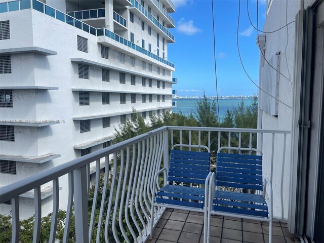 balcony featuring a water view