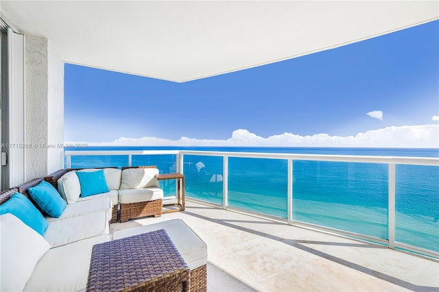 balcony with a view of the beach and a water view