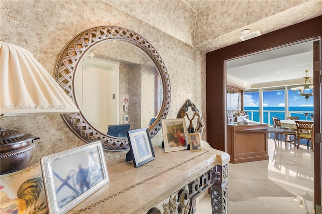 room details with a water view and a notable chandelier