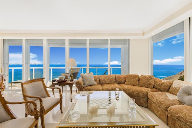 living room with a water view, a healthy amount of sunlight, and ornamental molding