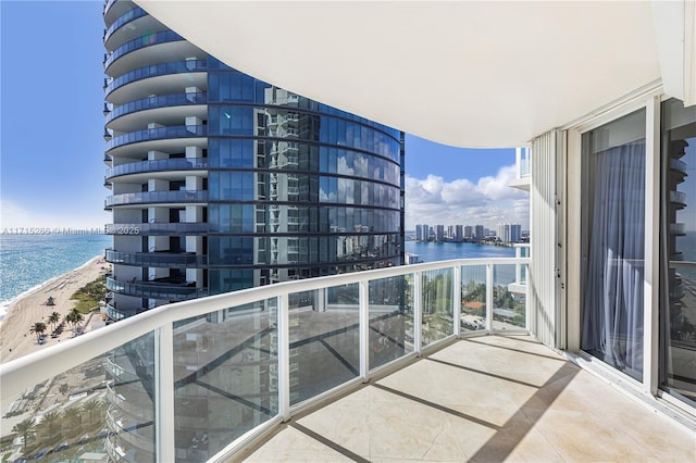 balcony with a view of the beach and a water view