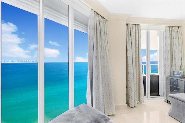 bedroom with a water view and crown molding