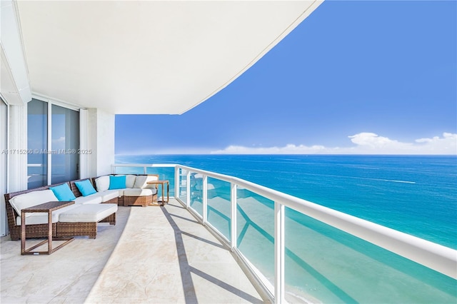 balcony featuring outdoor lounge area and a water view