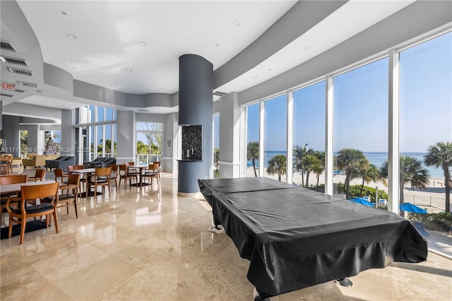 playroom featuring a water view, a healthy amount of sunlight, and billiards