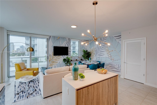 living room featuring floor to ceiling windows, light tile patterned floors, and a chandelier