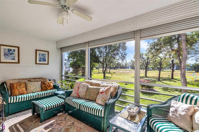 sunroom featuring ceiling fan