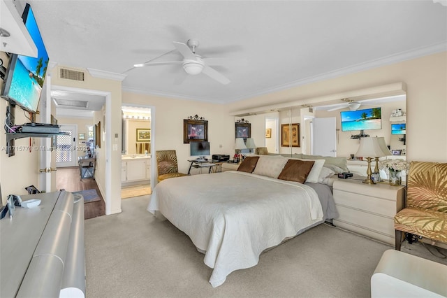 bedroom featuring connected bathroom, ceiling fan, light carpet, and ornamental molding