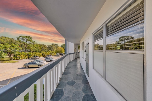 view of balcony at dusk