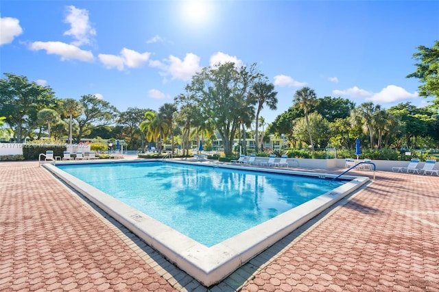 view of swimming pool with a patio area