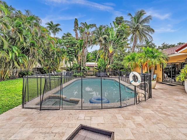 view of pool featuring a patio, fence, and a fenced in pool