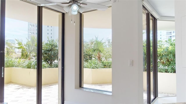 entryway featuring ceiling fan and a healthy amount of sunlight