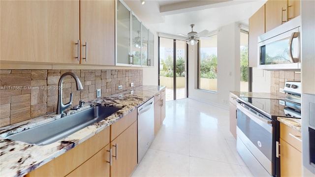 kitchen with ceiling fan, sink, white dishwasher, electric stove, and light brown cabinetry