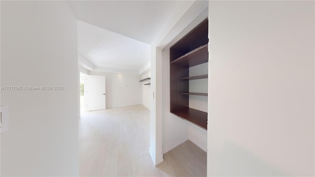 corridor featuring light hardwood / wood-style floors