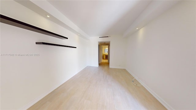 empty room with light wood-type flooring