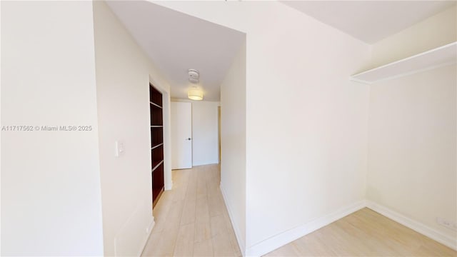 hall with light hardwood / wood-style floors