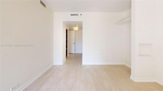 empty room with light wood-type flooring