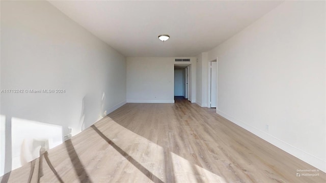 unfurnished room featuring light wood-type flooring