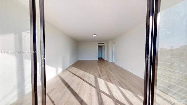 spare room with light hardwood / wood-style flooring