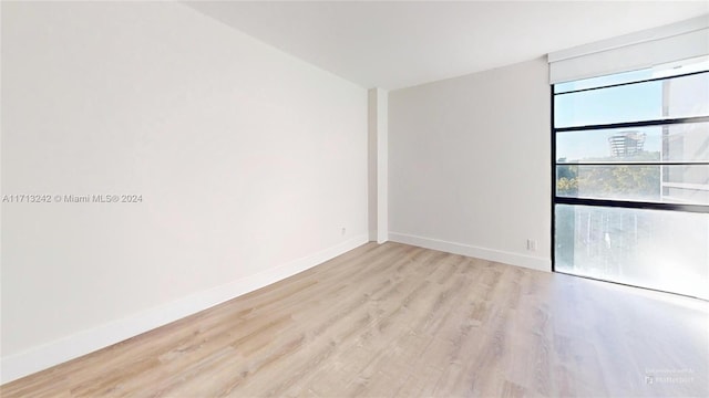 spare room featuring light wood-type flooring