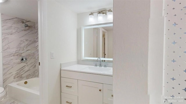 full bathroom with vanity, toilet, and tiled shower / bath