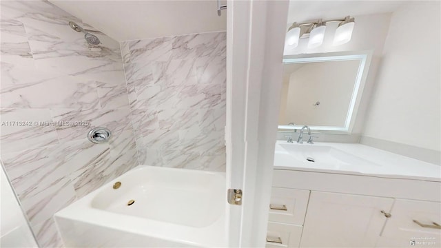 bathroom with vanity and tiled shower / bath combo