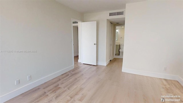 empty room featuring light hardwood / wood-style floors